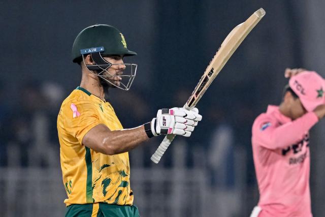 South Africa's Reeza Hendricks celebrates after scoring a half-century (50 runs) during the first Twenty20 international cricket match between Pakistan and South Africa at Rawalpindi Cricket Stadium in Rawalpindi on October 28, 2025. (Photo by Farooq NAEEM / AFP)