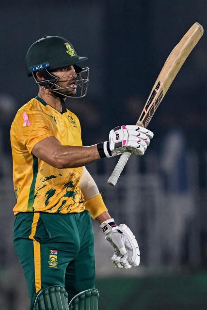South Africa's Reeza Hendricks celebrates after scoring a half-century (50 runs) during the first Twenty20 international cricket match between Pakistan and South Africa at Rawalpindi Cricket Stadium in Rawalpindi on October 28, 2025. (Photo by Farooq NAEEM / AFP)