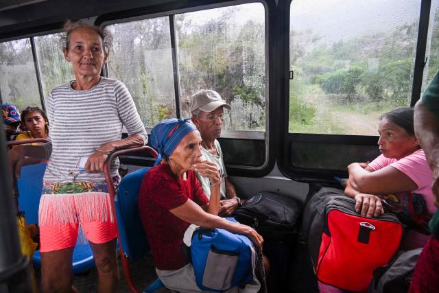 Residents are evacuated from Playa Siboney to safe locations ahead of the arrival of Hurricane Melissa, in Santiago de Cuba, Cuba, on October 28, 2025. Hurricane Melissa was set to strike nearby eastern end of Cuba late Tuesday after pummeling Jamaica. (Photo by YAMIL LAGE / AFP)