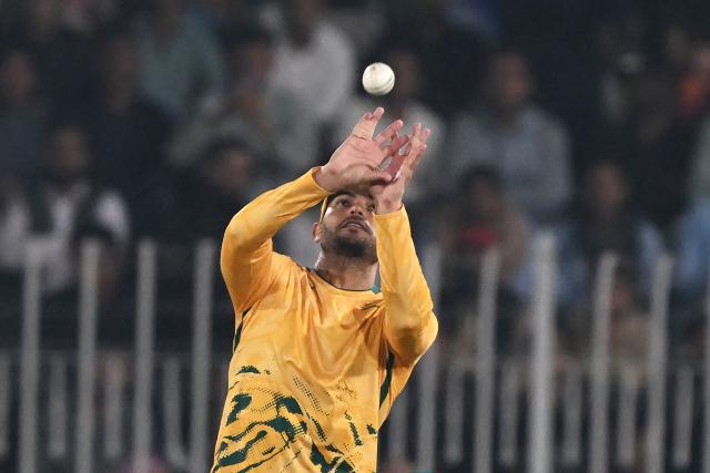 South Africa's Reeza Hendricks takes a catch for the wicket of Pakistan's Babar Azam (not pictured) during the first Twenty20 international cricket match between Pakistan and South Africa at the Rawalpindi Cricket Stadium in Rawalpindi on October 28, 2025. (Photo by Farooq NAEEM / AFP)