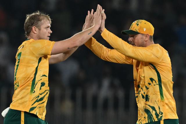 South Africa's Corbin Bosch (L) celebrates after taking the wicket of Pakistan's Salman Agha (not pictured) during the first Twenty20 international cricket match between Pakistan and South Africa at the Rawalpindi Cricket Stadium in Rawalpindi on October 28, 2025. (Photo by Farooq NAEEM / AFP)