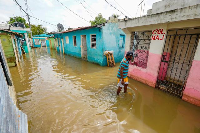 A man walks along a flooded street ahead of the arrival of Hurricane Melissa at Las Cucarachas neighborhood in Santo Domingo, Dominican Republic on October 28, 2025. (Photo by Danny Polanco / AFP)