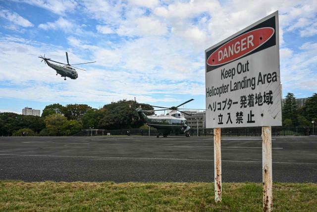 Marine One (L), transporting US President Donald Trump, departs to Haneda Airport in Tokyo on October 29, 2025. Trump heads on October 29 for South Korea, where a key meeting with Chinese leader Xi Jinping could produce a truce in the blistering trade war between the world's two largest economies. (Photo by ANDREW CABALLERO-REYNOLDS / AFP)
