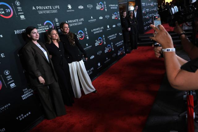 (L-R) French director Rebecca Zlotowski, US actress Jodie Foster and French writer Anne Berest attend the premiere of their movie "A Private Life" on the opening night of The American French Film Festival (TAFFF) at the DGA Theater in Los Angeles, California on October 28, 2025. (Photo by Etienne LAURENT / AFP)