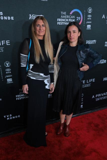 French director Helene Merlin (R) and producer Claire Franzoni attend the premiere of "A Private Life" on the opening night of The American French Film Festival (TAFFF) at the DGA Theater in Los Angeles, California on October 28, 2025. (Photo by Etienne LAURENT / AFP)