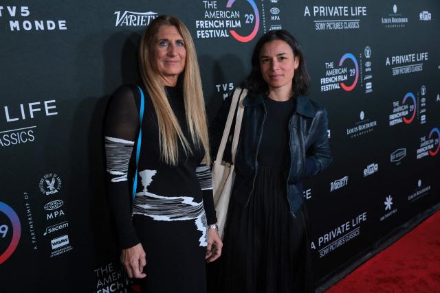 French director Helene Merlin (R) and producer Claire Franzoni attend the premiere of "A Private Life" on the opening night of The American French Film Festival (TAFFF) at the DGA Theater in Los Angeles, California on October 28, 2025. (Photo by Etienne LAURENT / AFP)