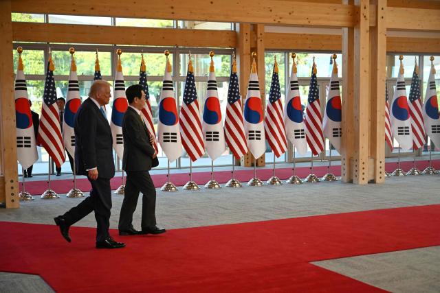 South Korean President Lee Jae Myung and US President Donald Trump attend an arrival ceremony at the Gyeongju National Museum in Gyeongju on October 29, 2025. (Photo by ANDREW CABALLERO-REYNOLDS / AFP)