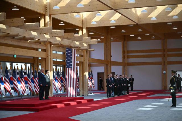 South Korean President Lee Jae Myung and US President Donald Trump attend an arrival ceremony at the Gyeongju National Museum in Gyeongju on October 29, 2025. (Photo by ANDREW CABALLERO-REYNOLDS / AFP)