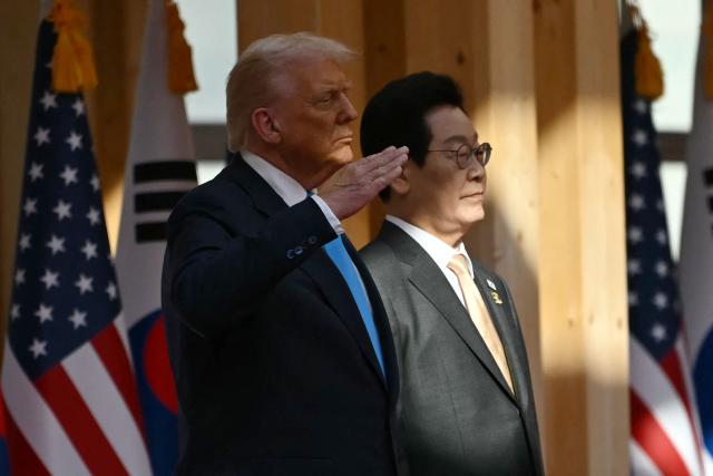 South Korean President Lee Jae Myung and US President Donald Trump attend an arrival ceremony at the Gyeongju National Museum in Gyeongju on October 29, 2025. (Photo by ANDREW CABALLERO-REYNOLDS / AFP)