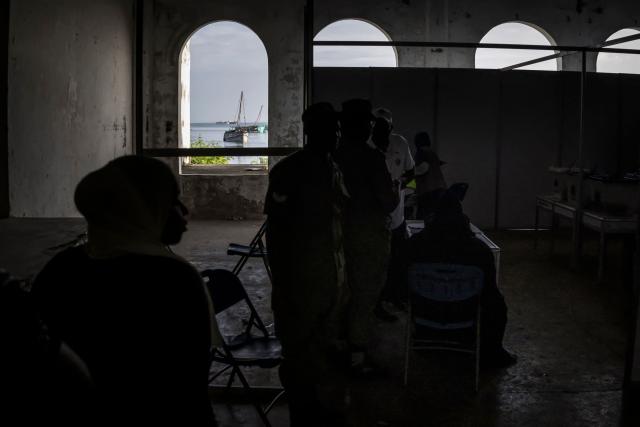 Voters wait to cast their ballots at the Maundi polling centre in Stone Town on October 29, 2025, during Tanzania’s presidential elections. Polls opened on October 29, 2025 in Tanzania elections in which the main challengers were either jailed or barred from running, with rights groups decrying a "wave of terror".
President Samia Suluhu Hassan, 65, is determined to cement her position with an emphatic victory that will silence critics within her own party, analysts say. (Photo by MARCO LONGARI / AFP)