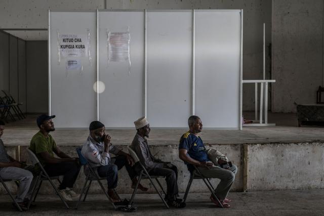 Voters queue at the Maundi polling centre in Stone Town on October 29, 2025, during Tanzania’s presidential elections. Polls opened on October 29, 2025 in Tanzania elections in which the main challengers were either jailed or barred from running, with rights groups decrying a "wave of terror".
President Samia Suluhu Hassan, 65, is determined to cement her position with an emphatic victory that will silence critics within her own party, analysts say. (Photo by MARCO LONGARI / AFP)