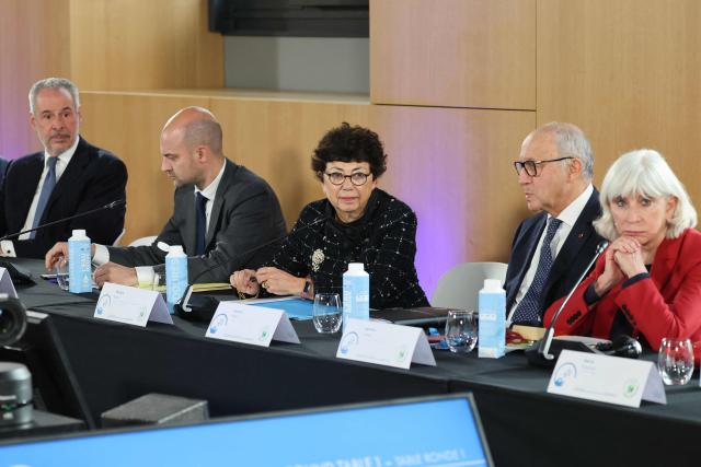 (From L) COP30 President-Designate Andre Correa do Lago, France's Minister for Europe and Foreign Affairs Jean-Noel Barrot, France's Minister of Ecological Transition, Biodiversity and International Negotiations on Climate a Monique Barbut, Former President of the Constitutional council Laurent Fabius, and French economist, academic, diplomat who served as France's Climate Change Ambassador Laurence Tubiana attend a round table session at the 8th Paris Peace Forum at the Palais Brongniart in Paris, on October 29, 2025. Over 300 participants including business, government and international organization leaders, academics and civil society members are meeting in Paris' Palais de Chaillot to discuss the issues of conflict resolution, climate and peace, marking the 10th anniversary of the Paris Agreement. (Photo by Ludovic MARIN / AFP)