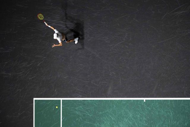 Monaco's Valentin Vacherot plays a forehand return to France's Arthur Rinderknech during their men's singles match on day three of the Paris ATP Masters 1000 tennis tournament at the Paris La Défense Arena in Nanterre, on the outskirts of Paris, on October 29, 2025. (Photo by Dimitar DILKOFF / AFP)