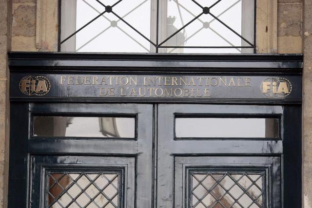 (FILES) Formula One's world governing body FIA logo is seen on September 19, 2009 at the entrance of its headquarters of the federation in Paris. Swiss racing driver Laura Villars filed legal action on October 29, 2025 against motorsport's governing body to challenge the FIA election rules, which effectively prevent her or any other candidate from running against incumbent president Mohammed Ben Sulayem. (Photo by JACQUES DEMARTHON / AFP)