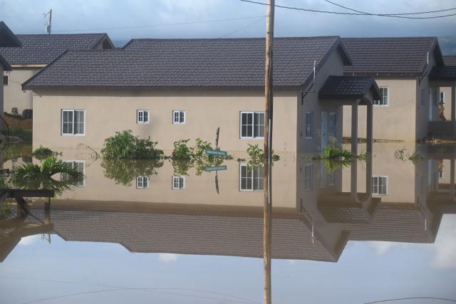 Flooded homes are seen after the passage of Hurricane Melissa in Howard Acres neighbourhood in St. Elizabeth, Jamaica on October 29, 2025. Hurricane Melissa ripped up trees and knocked out power after making landfall in Jamaica on October 28, 2025 as one of the most powerful hurricanes on record, inundating the island nation with rains that threaten flash floods and landslides. (Photo by Ricardo MAKYN / AFP)