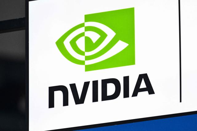 (FILES) The Nvidia logo is seen during the World Artificial Intelligence Conference (WAIC) at the Shanghai World Expo and Convention Center in Shanghai on July 28, 2025. AI chip juggernaut Nvidia became the world's first $5 trillion company on October 29, 2025, as investors remain confident that artificial intelligence will deliver a new wave of innovation and growth. The California-based tech giant saw its share price rise by 4.91 percent to $210.90 at the open of trading on Wall Street, pushing Nvidia's market capitalization past the never-before-seen threshold. (Photo by Hector RETAMAL / AFP)