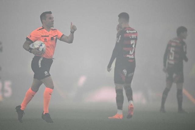 Chilean referee Piero Maza gestures ahead of the Copa Libertadores semifinal second leg football match between Argentina's Racing and Brazil's Flamengo at the Presidente Juan Domingo Peron - El Cilindro stadium in Avellaneda, Buenos Aires province, on October 29, 2025. (Photo by Luis ROBAYO / AFP)