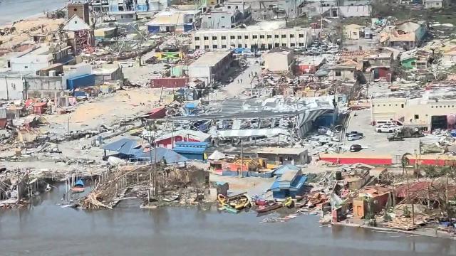 This screen grab from an aerial video shows damaged buildings and structures in St. Elizabeth Parish, Jamaica, on October 29, 2025, after Hurricane Melissa tore through the island. Hurricane Melissa ripped up trees and knocked out power after making landfall in Jamaica on October 28, 2025 as one of the most powerful hurricanes on record, inundating the island nation with rains that threaten flash floods and landslides. (Photo by AFP VIDEOGRAPHICS / AFP)