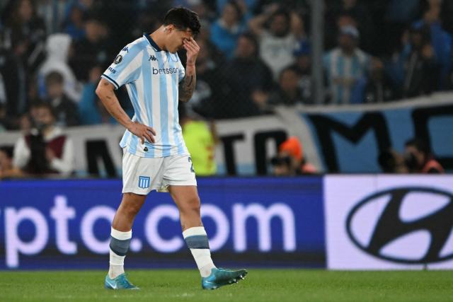 Racing's defender #23 Nazareno Colombo reacts after losing the Copa Libertadores semifinal second leg football match between Argentina's Racing and Brazil's Flamengo at the Presidente Juan Domingo Peron - El Cilindro stadium in Avellaneda, Buenos Aires province, on October 29, 2025. (Photo by Luis ROBAYO / AFP)