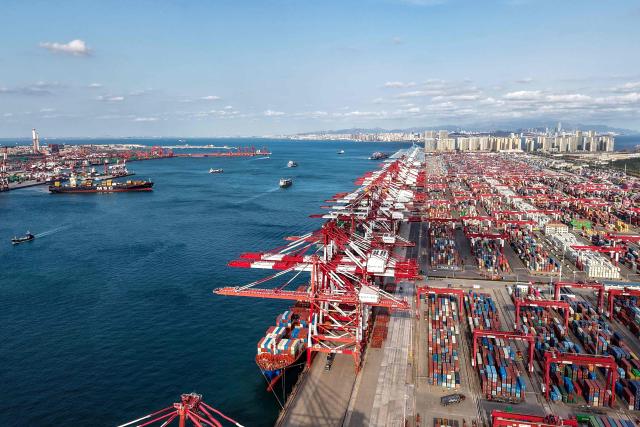 An aerial view shows the port in Qingdao, in China’s eastern Shandong province on October on October 29, 2025. (Photo by AFP) / China OUT