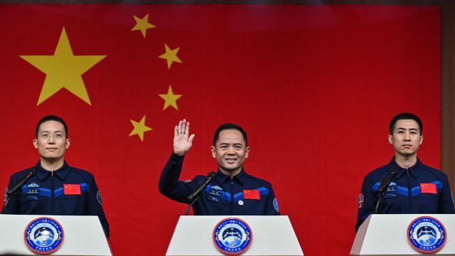 Astronauts for China's Shenzhou-21 space mission Zhang Hongzhang (L), Commander Zhang Lu (C) and Wu Fei (R) attend a press conference a day before the launch of the mission at the Jiuquan Satellite Launch Centre in the Gobi desert, in northwest China on October 30, 2025. (Photo by Hector RETAMAL / AFP)
