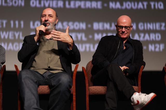 French director Cedric Klapisch (L) and French producer Bruno Levy (R) take part in a Q&A after the screening of "Colours of Time" at The American French Film Festival (TAFFF) at the Directors Guild of America (DGA) Theater in Los Angeles on October 29, 2025. The 29th edition of The American French Film Festival takes place at the Directors Guild of America (DGA) from October 28 to November 3. (Photo by VALERIE MACON / AFP)