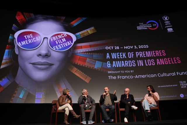(L-R) Translator, moderator and US screenwriter Kevin Bernhardt, French director Cedric Klapisch, French producer Bruno Levy, and French composer Rob (Robin Coudert) take part in a Q&A after the screening of "Colours of Time" at The American French Film Festival (TAFFF) at the Directors Guild of America (DGA) Theater in Los Angeles on October 29, 2025. The 29th edition of The American French Film Festival takes place at the Directors Guild of America (DGA) from October 28 to November 3. (Photo by VALERIE MACON / AFP)