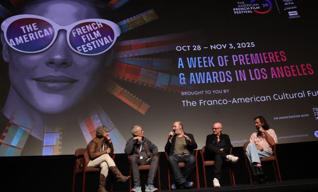 (L-R) Translator, moderator and US screenwriter Kevin Bernhardt, French director Cedric Klapisch, French producer Bruno Levy, and French composer Rob (Robin Coudert) take part in a Q&A after the screening of "Colours of Time" at The American French Film Festival (TAFFF) at the Directors Guild of America (DGA) Theater in Los Angeles on October 29, 2025. The 29th edition of The American French Film Festival takes place at the Directors Guild of America (DGA) from October 28 to November 3. (Photo by VALERIE MACON / AFP)