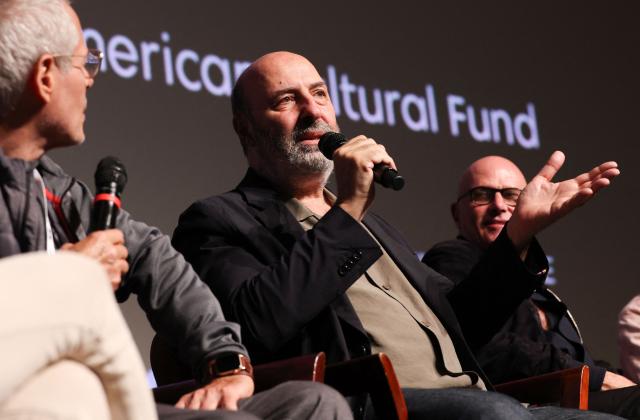 Moderator and US screenwriter Kevin Bernhardt (L), French director Cedric Klapisch (C) and French producer Bruno Levy take part in a Q&A after the screening of "Colours of Time" at The American French Film Festival (TAFFF) at the Directors Guild of America (DGA) Theater in Los Angeles on October 29, 2025. The 29th edition of The American French Film Festival takes place at the Directors Guild of America (DGA) from October 28 to November 3. (Photo by VALERIE MACON / AFP)