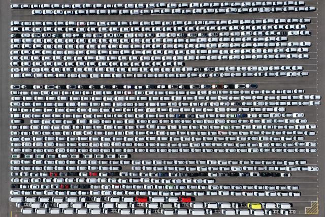 (FILES) An aerial view shows new cars of German car maker Volkswagen group ready for shipping next to the Volkswagen plant in Emden, northwestern Germany, on May 20, 2025. Volkswagen reported its first quarterly loss for five years on October 30, 2025 of over one billion euros, as the German auto giant struggles with US tariffs and a troubled electric shift at subsidiary Porsche. The loss in the July to September period amounted to 1.07 billion euros ($1.24 billion) and was the first suffered by Europe's biggest carmaker since the second quarter of 2020, when it was hit by the coronavirus pandemic. (Photo by Ina FASSBENDER / AFP)