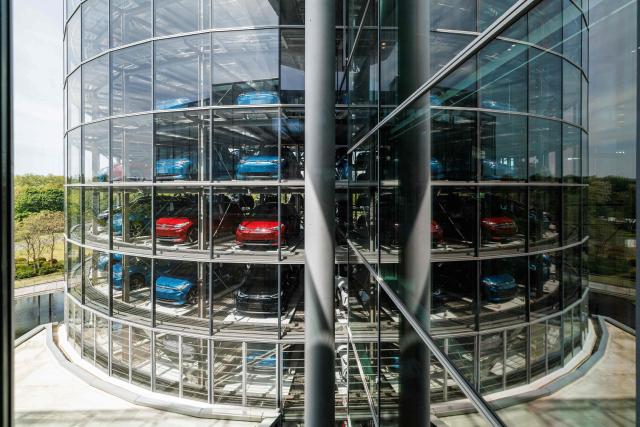 (FILES) Finished cars are seen in the car tower after coming off the assembly line for the Volkswagen (VW) ID.3 electric car of German carmaker Volkswagen, at the 'Transparent Factory' (Glaeserne Manufaktur) production site of German carmaker Volkswagen (VW) in Dresden, eastern Germany, on May 14, 2025. Volkswagen reported its first quarterly loss for five years on October 30, 2025 of over one billion euros, as the German auto giant struggles with US tariffs and a troubled electric shift at subsidiary Porsche. The loss in the July to September period amounted to 1.07 billion euros ($1.24 billion) and was the first suffered by Europe's biggest carmaker since the second quarter of 2020, when it was hit by the coronavirus pandemic. (Photo by JENS SCHLUETER / AFP)