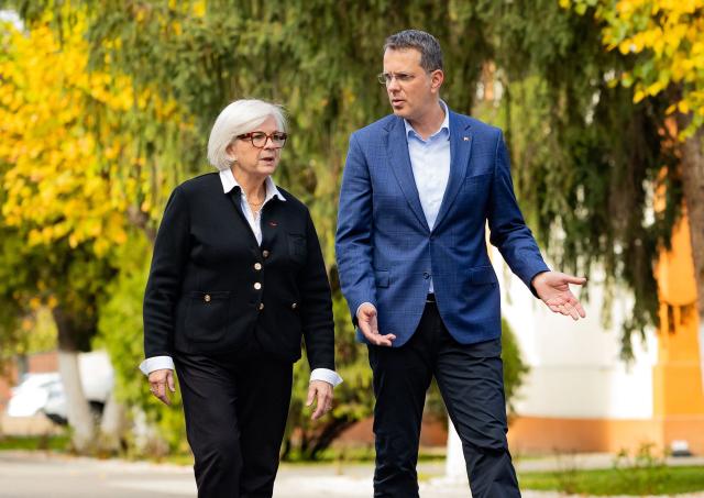 France's Defence Minister Catherine Vautrin and Romania's Defence Minister Ionut Mosteanu (R) walk after inspecting an honory guard at the Ground Forces Academy in Sibiu, Romania on October 30, 2025. France's Defence Minister Catherine Vautrin aslo visited the contingents deployed at the "Getica" National Joint Training Center in Cincu, where the French-led NATO battle group in Romania is based. (Photo by Ovidiu MATIU / AFP)