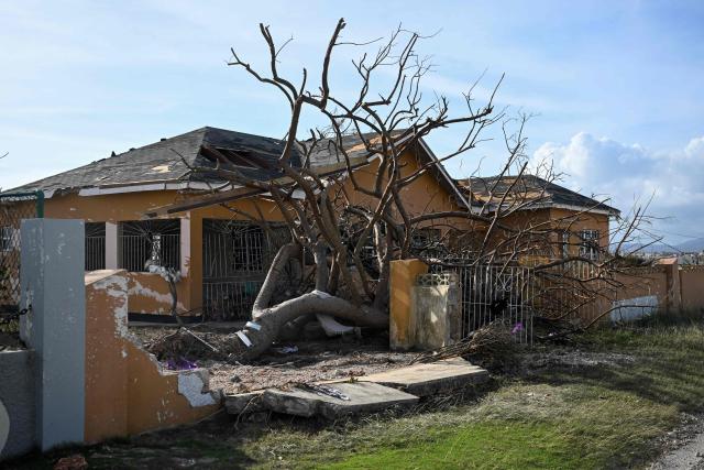 A building is seen damaged following the passage of Hurricane Melissa, in Black River, St. Elizabeth, Jamaica on October 29, 2025. Hurricane Melissa bore down on the Bahamas October 29 after cutting a path of destruction through the Caribbean, leaving 30 people dead or missing in Haiti and parts of Jamaica and Cuba in ruins. 
Somewhat weakened but still threatening, Melissa will bring damaging winds and flooding rains to the Bahamas Wednesday before moving on to Bermuda late Thursday, according to the US National Hurricane Center (NHC). (Photo by Ricardo Makyn / AFP)
