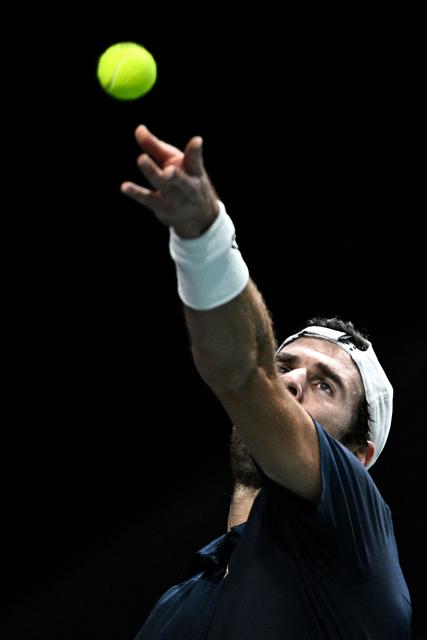 Russia's Karen Khachanov serves to Australia's Alex De Minaur during their men's singles match on day four of the Paris ATP Masters 1000 tennis tournament at the Paris La Défense Arena in Nanterre, on the outskirts of Paris, on October 30, 2025. (Photo by JULIEN DE ROSA / AFP)