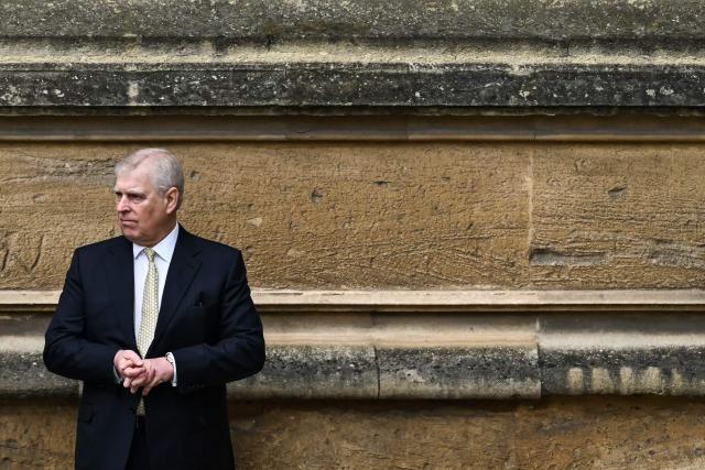 (FILES) Britain's Prince Andrew, Duke of York reacts as he arrives at St. George's Chapel, Windsor Castle, to attend the Easter Mattins Service, on March 31, 2024. King Charles will strip his younger brother Andrew of his royal titles and long-term residence, the palace said in a statement on on October 30, 2025. "His Majesty has today initiated a formal process to remove the Style, Titles and Honours of Prince Andrew," it said. "Prince Andrew will now be known as Andrew Mountbatten Windsor," it said, adding that he would also move out of his long-time home on Windsor Castle's sprawling grounds. The announcement followed fresh outrage at accusations made against him by one of Jeffrey Epstein's main accusers, charges he has denied. (Photo by JUSTIN TALLIS / AFP)