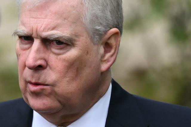 (FILES) Britain's Prince Andrew, Duke of York reacts as he leaves St. George's Chapel, in Windsor Castle, after attending the Easter Mattins Service, on March 31, 2024. King Charles will strip his younger brother Andrew of his royal titles and long-term residence, the palace said in a statement on on October 30, 2025. "His Majesty has today initiated a formal process to remove the Style, Titles and Honours of Prince Andrew," it said. "Prince Andrew will now be known as Andrew Mountbatten Windsor," it said, adding that he would also move out of his long-time home on Windsor Castle's sprawling grounds. The announcement followed fresh outrage at accusations made against him by one of Jeffrey Epstein's main accusers, charges he has denied. (Photo by JUSTIN TALLIS / AFP)