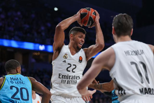 Real Madrid's Cape Verdean center #22 Walter Tavares grabs a rebound during the Euroleague basketball match between Real Madrid Baloncesto and Fenerbahce Beko Istanbul at Movistar Arena in Madrid on October 30, 2025. (Photo by Oscar DEL POZO / AFP)