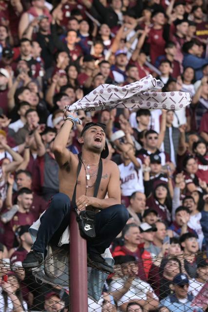 A Lanus fan cheers for his team ahead of the Copa Sudamericana semifinal second leg football match between Argentina's Lanus and Chile's Universidad de Chile at the Ciudad de Lanus stadium in Lanus, Buenos Aires province, on October 30, 2025. (Photo by JUAN MABROMATA / AFP)