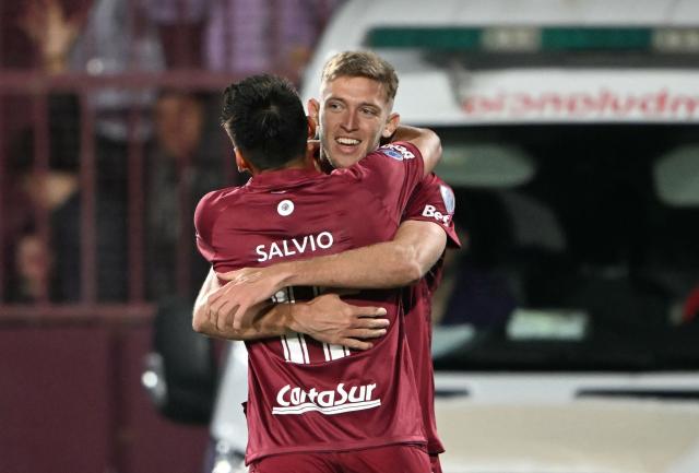 Lanus' midfielder #19 Rodrigo Castillo (L) celebrates scoring his team's first goal with teammate midfielder #11 Eduardo Salvio (L) during the Copa Sudamericana semifinal second leg football match between Argentina's Lanus and Chile's Universidad de Chile at the Ciudad de Lanus stadium in Lanus, Buenos Aires province, on October 30, 2025. (Photo by Luis ROBAYO / AFP)
