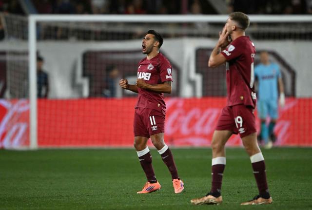 Lanus' midfielder #11 Eduardo Salvio celebrates his team's first goal during the Copa Sudamericana semifinal second leg football match between Argentina's Lanus and Chile's Universidad de Chile at the Ciudad de Lanus stadium in Lanus, Buenos Aires province, on October 30, 2025. (Photo by Luis ROBAYO / AFP)