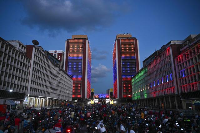 Supporters of Venezuelan President Nicolas Maduro take part in a rally against US military activity in the Caribbean, in Caracas on October 30, 2025. A US guided-missile destroyer that docked for four days in Trinidad and Tobago, within firing range of mainland Venezuela -- which called its presence a "provocation" -- departed as scheduled on Thursday, AFP witnessed. (Photo by Federico PARRA / AFP)