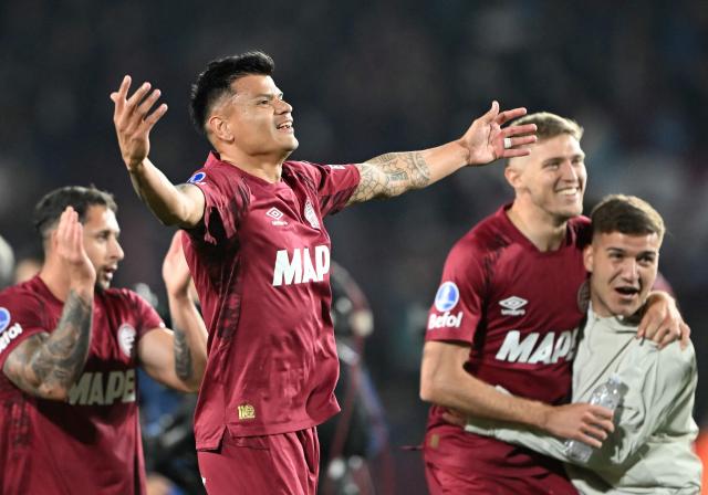 Lanus' forward #09 Walter Bou celebrates after winning the Copa Sudamericana semifinal second leg football match between Argentina's Lanus and Chile's Universidad de Chile at the Ciudad de Lanus stadium in Lanus, Buenos Aires province, on October 30, 2025. (Photo by Luis ROBAYO / AFP)