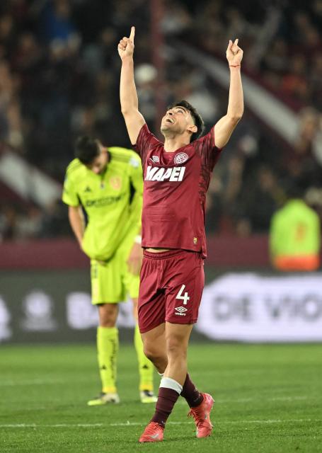 Lanus' Uruguayan defender #04 Gonzalo Perez celebrates after winning the Copa Sudamericana semifinal second leg football match between Argentina's Lanus and Chile's Universidad de Chile at the Ciudad de Lanus stadium in Lanus, Buenos Aires province, on October 30, 2025. (Photo by Luis ROBAYO / AFP)