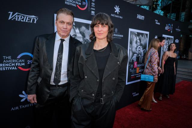 US actor Holt McCallany (L) and French composer and DJ Chloй Thevenin attend the premiere of Netflix’s "Nouvelle Vague" during The American French Film Festival (TAFFF) at the Directors Guild of America (DGA) Theater in Los Angeles on October 30, 2025. The 29th edition of The American French Film Festival takes place at the Directors Guild of America (DGA) from October 28 to November 3. (Photo by ETIENNE LAURENT / AFP)