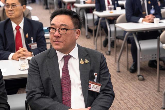 (FILES) Julapun Amornvivat, Pheu Thai Party's MP for Chiang Mai, attends a party meeting to decide who to put forward as candidate for prime minister at parliament in Bangkok on August 15, 2024. One of Thailand's largest political parties Pheu Thai, founded by ex-premier Thaksin Shinwatra, elected its new leader Julapun Amornvivat on October 31, 2025, the party said, following the resignation of Thaksin's daughter Paetongtarn Shinwatra after a court found her guilty of an ethics breach linked to a border dispute with Cambodia during her time as prime minister. (Photo by Chanakarn Laosarakham / AFP)