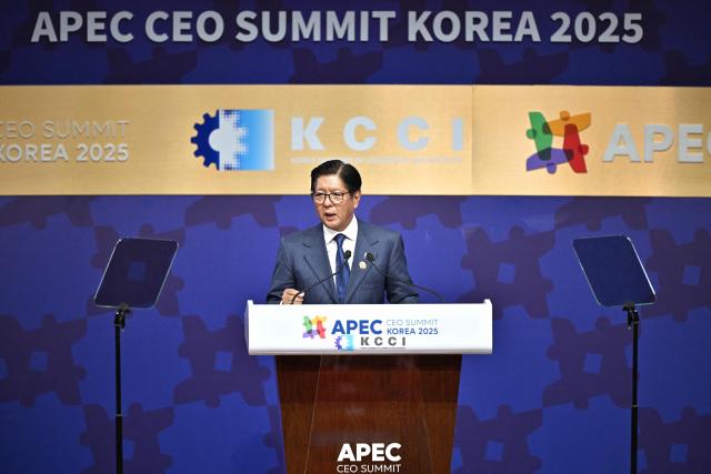 Philippines' President Ferdinand Marcos Jr delivers a speech during the Asia-Pacific Economic Cooperation (APEC) CEO Summit at the Gyeongju Arts Center in Gyeongju on October 31, 2025. (Photo by ANTHONY WALLACE / AFP)