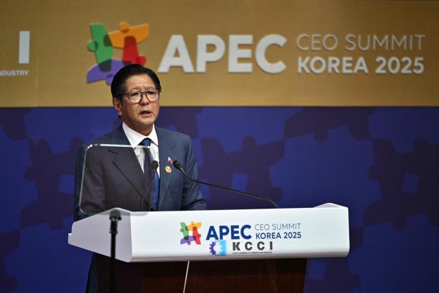 Philippines' President Ferdinand Marcos Jr delivers a speech during the Asia-Pacific Economic Cooperation (APEC) CEO Summit at the Gyeongju Arts Center in Gyeongju on October 31, 2025. (Photo by ANTHONY WALLACE / AFP)