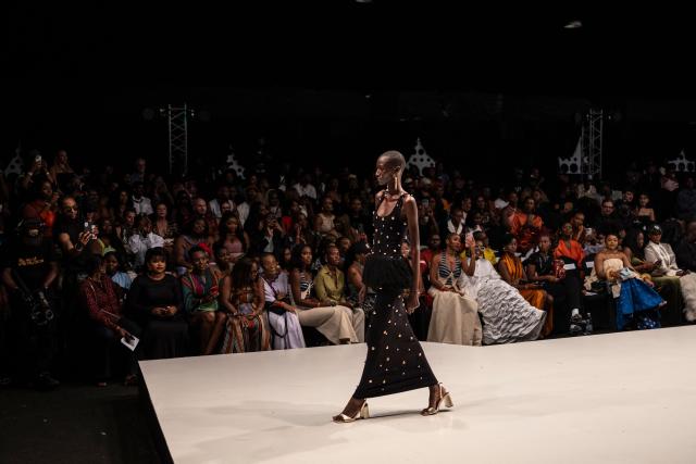 A model wearing a creation by Nigerian designer Hertunba walks the runway  during Lagos Fashion Week in Lagos, on October 30, 2025. (Photo by OLYMPIA DE MAISMONT / AFP)