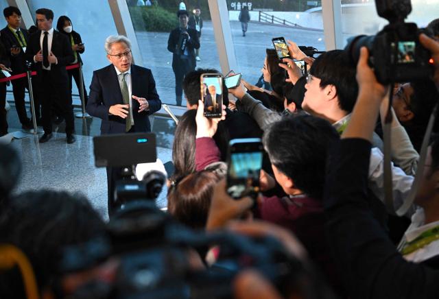 Nvidia founder and CEO Jensen Huang speaks to the media at the Asia-Pacific Economic Cooperation (APEC) CEO Summit in Gyeongju on October 31, 2025. (Photo by Jung Yeon-je / AFP)