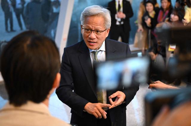 Nvidia founder and CEO Jensen Huang speaks to the media at the Asia-Pacific Economic Cooperation (APEC) CEO Summit in Gyeongju on October 31, 2025. (Photo by Jung Yeon-je / AFP)